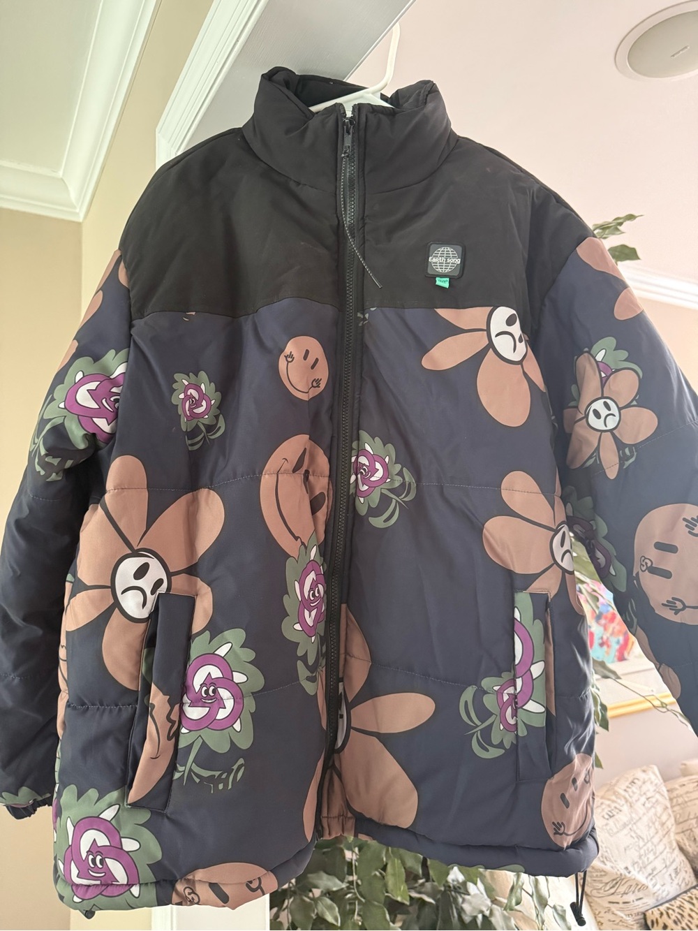 Black Smiley Graphic Puffer Jacket with Tan Accents